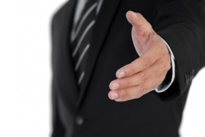 Closeup image of business man shake hand with you.